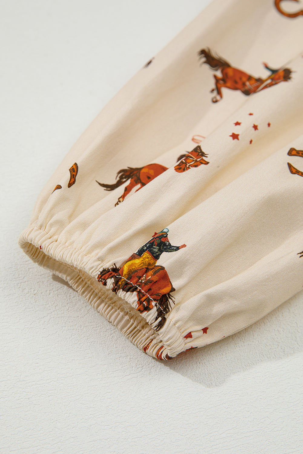 Apricot Rodeo Print Peplum Top